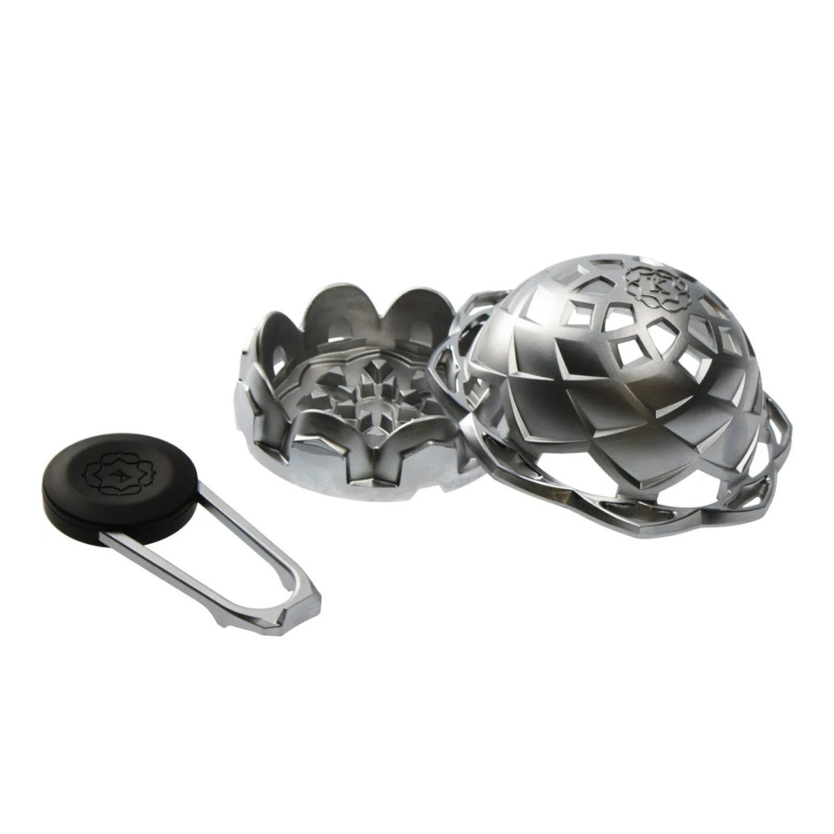 Kaloud Lotus II heat management device shown disassembled, revealing the inner heat plate, outer shell, and key with carrying clip