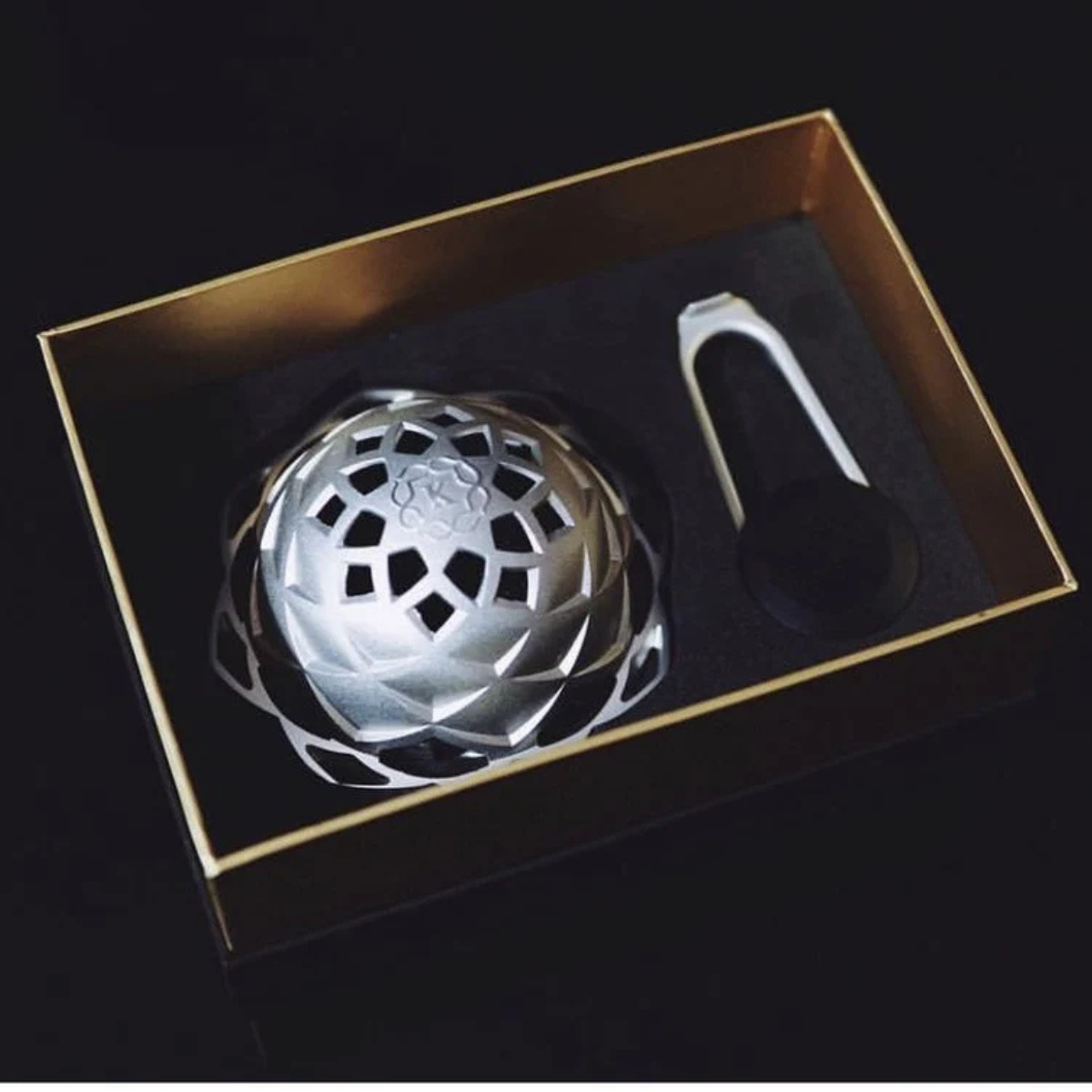 Kaloud Lotus II heat management device and key nested in the open gift box lined with black foam